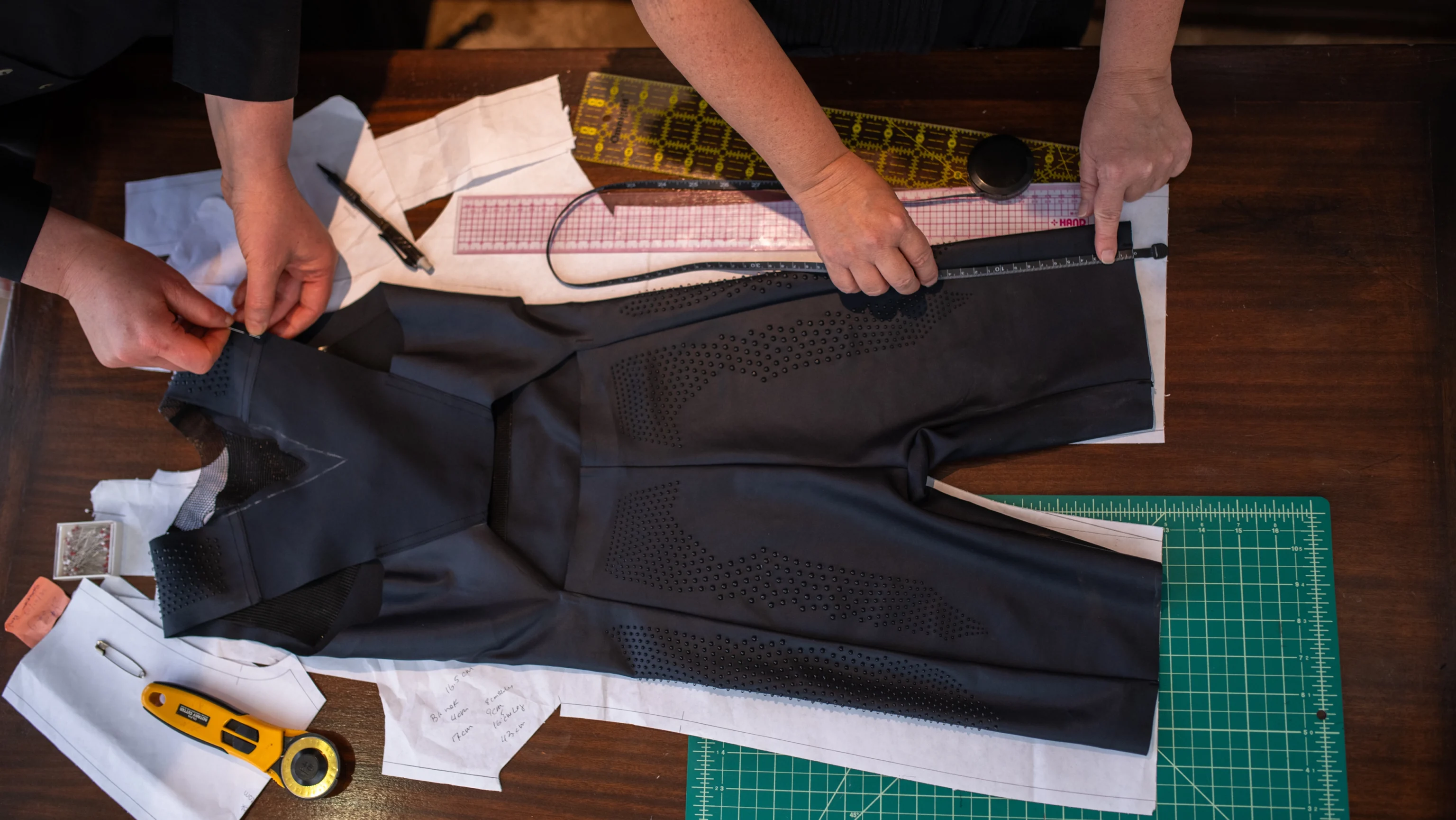 Nike design team custom fitting apparel for Faith Kipyegon's Breaking 4. PC: Nike